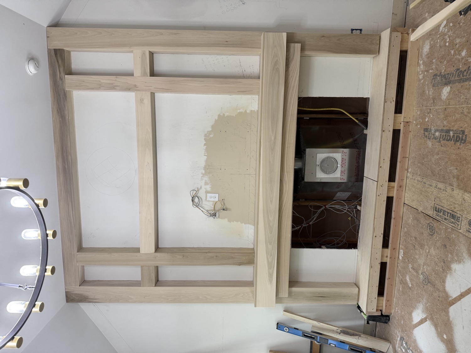 Custom fireplace media wall framing before